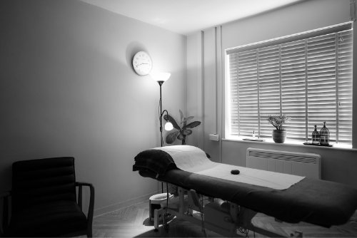 Young girl smiling receiving paediatric acupuncture